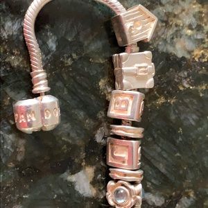 Pandora 8” bracelet with 10 charms and 8 spacers.